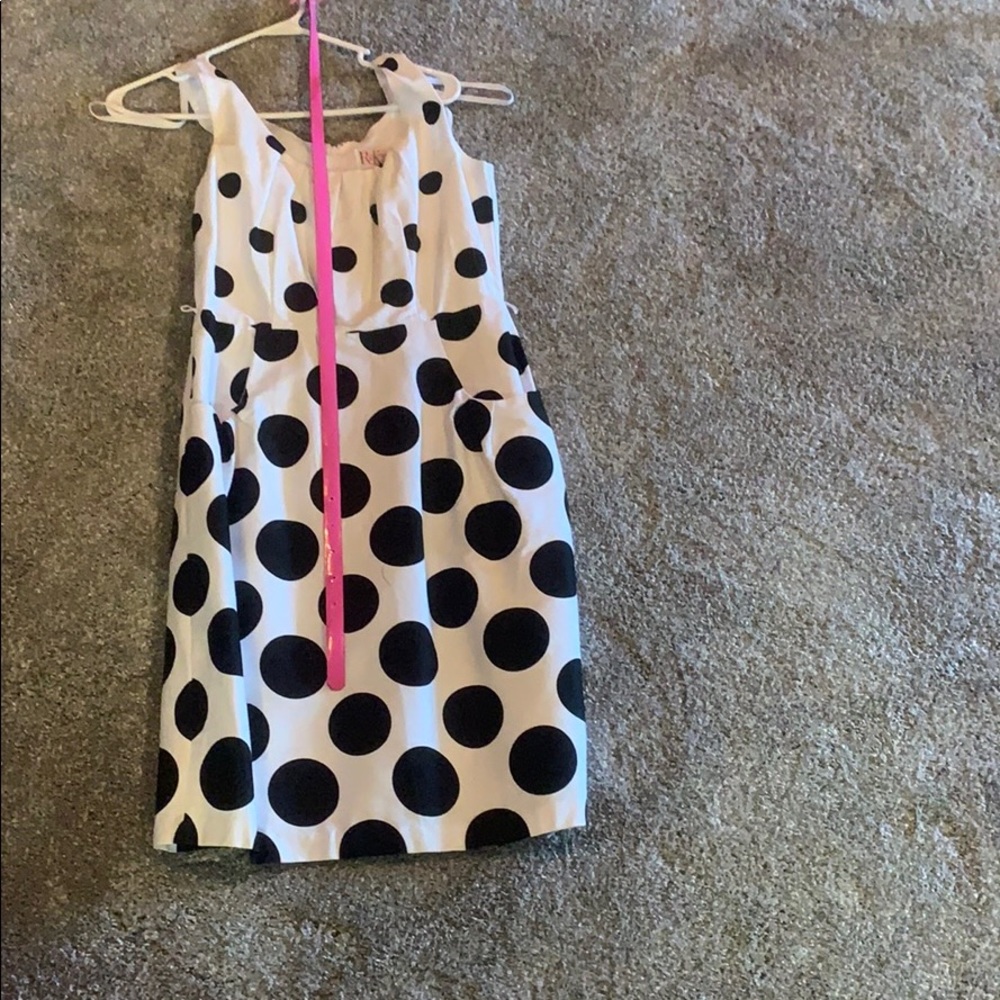 Black and whit polka dot dress with pink belt